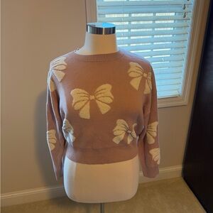 Women's Pink Sweater with Bow Design